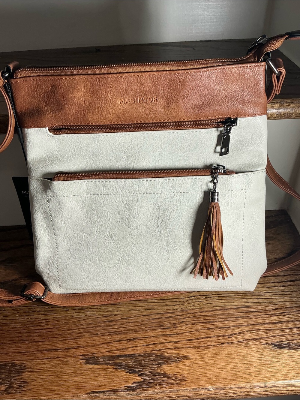 Neutral Cream and Tan Crossbody Bag with Tassel Accent